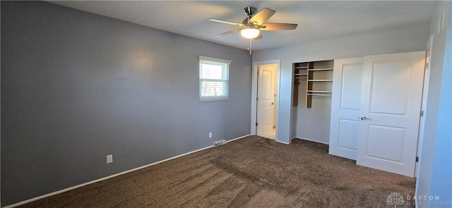 unfurnished bedroom featuring a closet, ceiling fan, and dark colored carpet