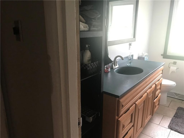 7581 Lockwood St, Dayton, OH 45415 - bathroom with vanity and tile patterned floors