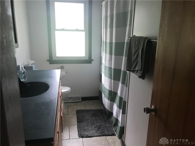 7581 Lockwood St, Dayton, OH 45415 - bathroom featuring vanity, tile patterned flooring, and a shower with shower curtain