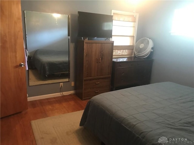 7581 Lockwood St, Dayton, OH 45415 - bedroom with wood finished floors and baseboards