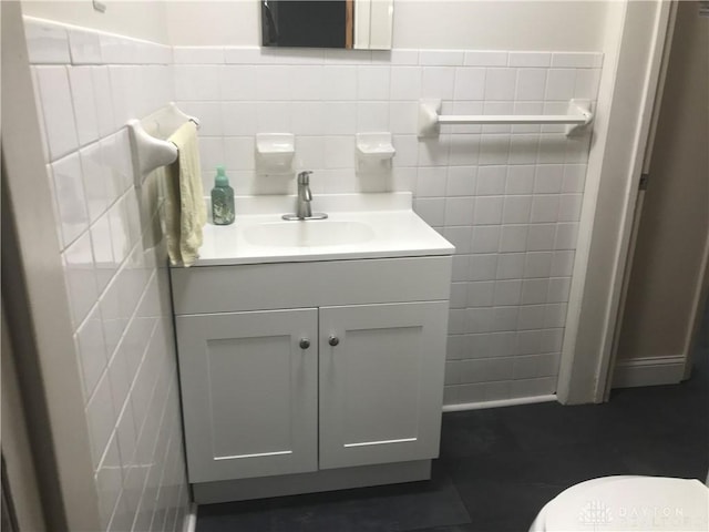 7581 Lockwood St, Dayton, OH 45415 - half bathroom with tile walls and vanity