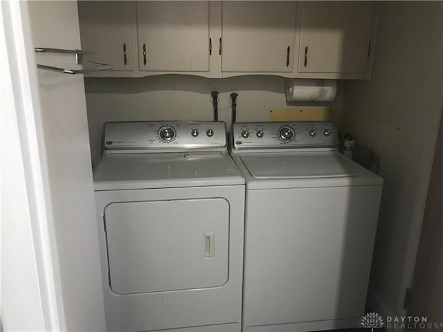 7581 Lockwood St, Dayton, OH 45415 - laundry area with separate washer and dryer and cabinet space