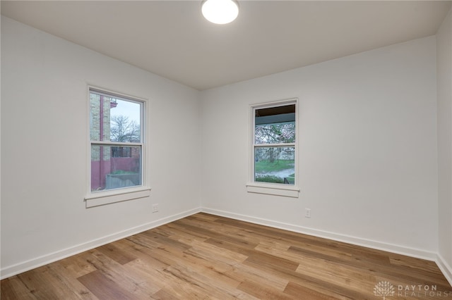1711 Emerson Ave, Dayton, OH 45406 - empty room featuring a wealth of natural light, light wood-type flooring, and baseboards