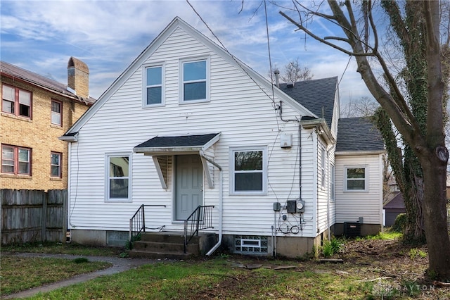 1711 Emerson Ave, Dayton, OH 45406 - view of front of property featuring roof with shingles, central AC, and fence