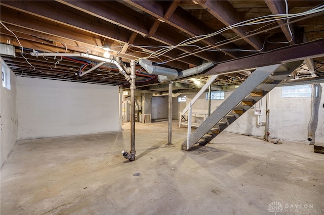 1711 Emerson Ave, Dayton, OH 45406 - basement with water heater, a healthy amount of sunlight, and stairway