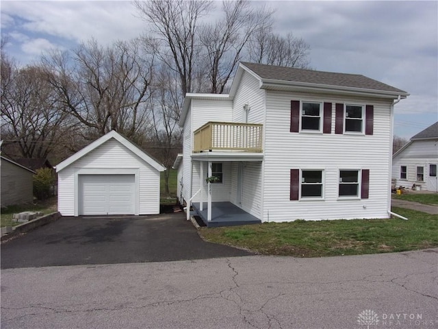 127 New Burlington Rd, Waynesville, OH 45068 - view of front of house featuring a balcony, an outbuilding, driveway, and a garage