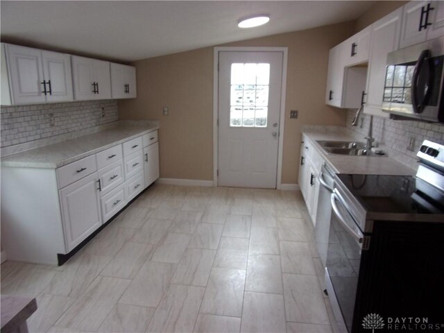 127 New Burlington Rd, Waynesville, OH 45068 - kitchen with baseboards, white cabinetry, light countertops, and appliances with stainless steel finishes