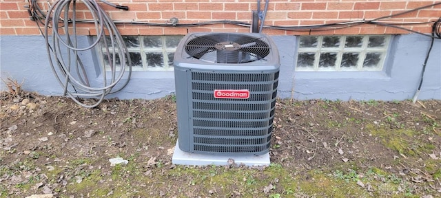 exterior details with brick siding and cooling unit