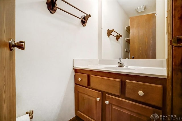 bathroom with visible vents and vanity