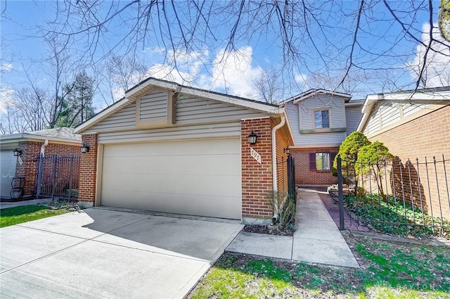 view of front facade featuring brick siding, fence, concrete driveway, and a garage