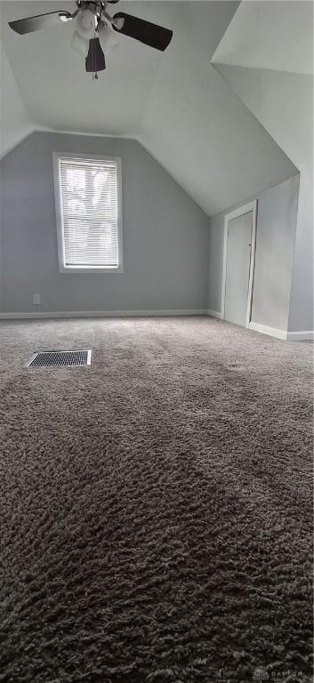 bonus room featuring vaulted ceiling, visible vents, ceiling fan, and carpet flooring