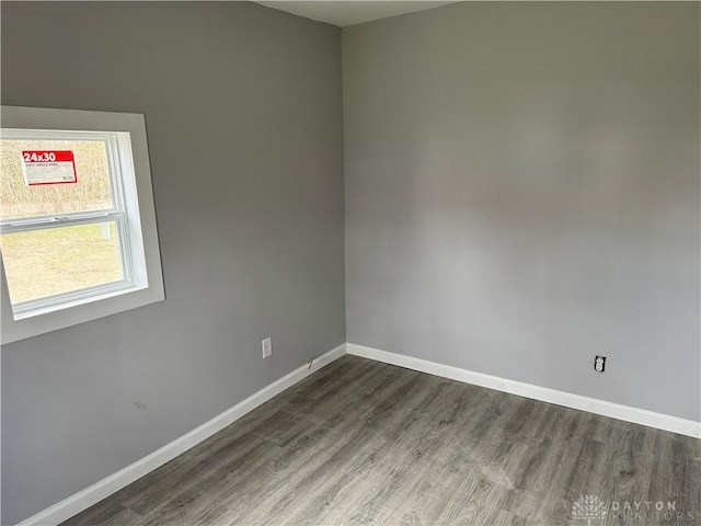 6718 Faversham Rd, Miamisburg, OH 45342 - empty room with dark wood-style flooring and baseboards
