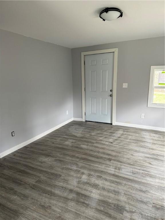 6718 Faversham Rd, Miamisburg, OH 45342 - empty room with dark wood finished floors and baseboards