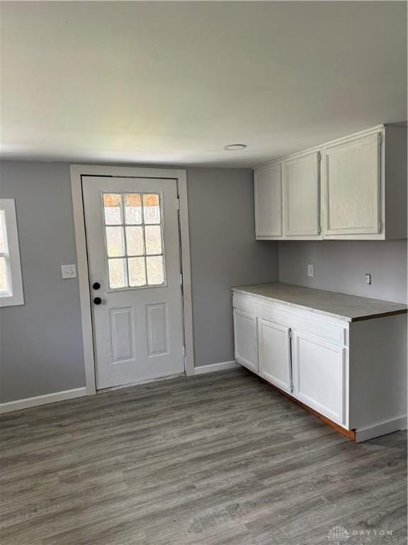6718 Faversham Rd, Miamisburg, OH 45342 - doorway with baseboards, a healthy amount of sunlight, and dark wood finished floors