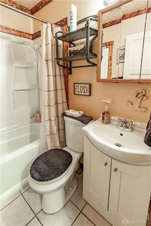 2311 Eden Ln, Dayton, OH 45431 - bathroom featuring toilet, vanity, shower / bath combo with shower curtain, and tile patterned floors