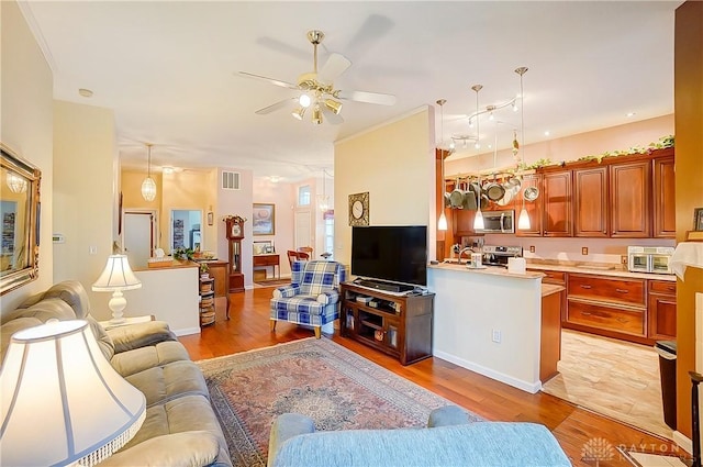3949 E Summit Ridge Dr, Beavercreek, OH 45430 - living area featuring a ceiling fan and light wood-style floors