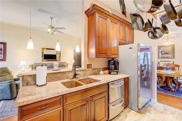 3949 E Summit Ridge Dr, Beavercreek, OH 45430 - kitchen featuring a sink, appliances with stainless steel finishes, open floor plan, brown cabinetry, and ceiling fan