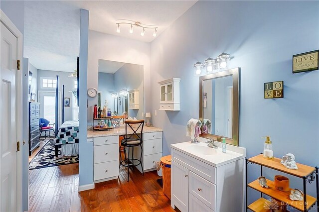3949 E Summit Ridge Dr, Beavercreek, OH 45430 - bathroom featuring wood-type flooring, vanity, and ensuite bath