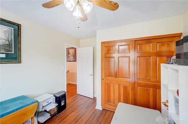 3949 E Summit Ridge Dr, Beavercreek, OH 45430 - bedroom featuring wood finished floors, a ceiling fan, and a closet