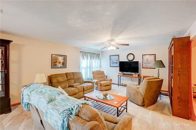3949 E Summit Ridge Dr, Beavercreek, OH 45430 - living area with ceiling fan, baseboards, and light colored carpet