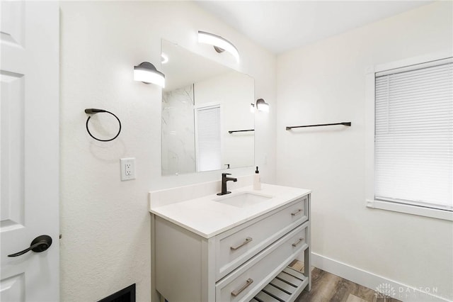 1615 Carrollton Ave, Dayton, OH 45409 - bathroom featuring baseboards, wood finished floors, and vanity
