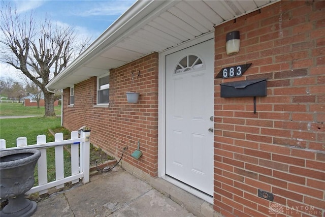 entrance to property with brick siding
