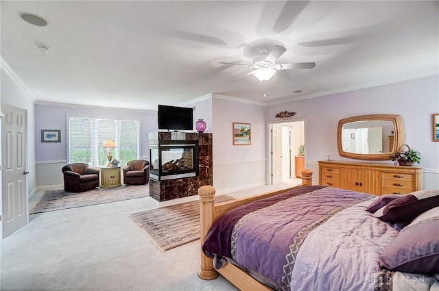 3558 Golden Fox Trl, Lebanon, OH 45036 - bedroom featuring a fireplace, crown molding, a ceiling fan, and carpet floors