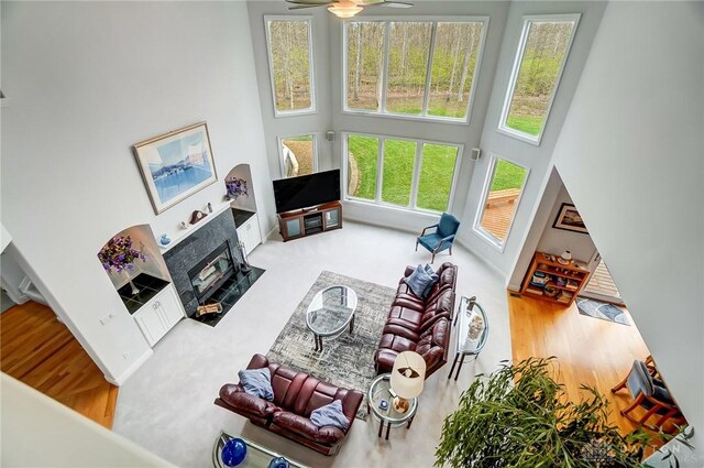 3558 Golden Fox Trl, Lebanon, OH 45036 - living room with a fireplace, a towering ceiling, and ceiling fan