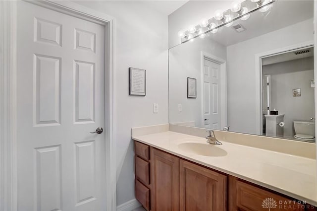 3558 Golden Fox Trl, Lebanon, OH 45036 - bathroom with toilet, visible vents, vanity, and baseboards
