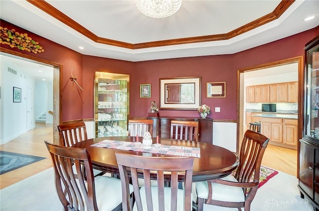 3558 Golden Fox Trl, Lebanon, OH 45036 - dining room with ornamental molding, visible vents, light wood-style flooring, and a raised ceiling