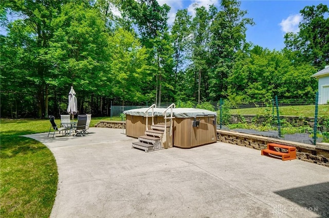 3558 Golden Fox Trl, Lebanon, OH 45036 - view of patio featuring fence, outdoor dining space, and a hot tub