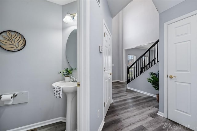 bathroom featuring baseboards and wood finished floors