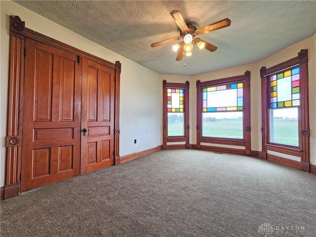 5469 Davis Rd, Jamestown Vlg, OH 45335 - unfurnished bedroom with carpet floors, baseboards, and multiple windows