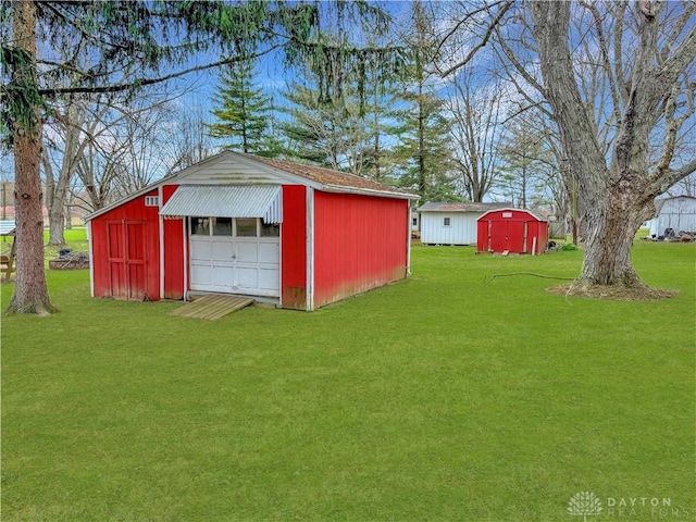 detached garage featuring a storage unit