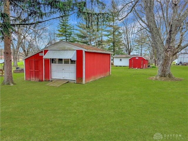 6898 White Springs Dr, Greenville, OH 45331 - view of outbuilding with an outdoor structure and driveway