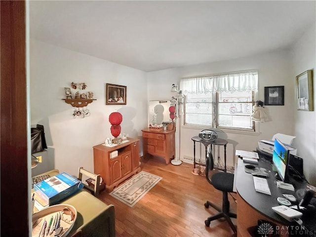 home office with light wood finished floors