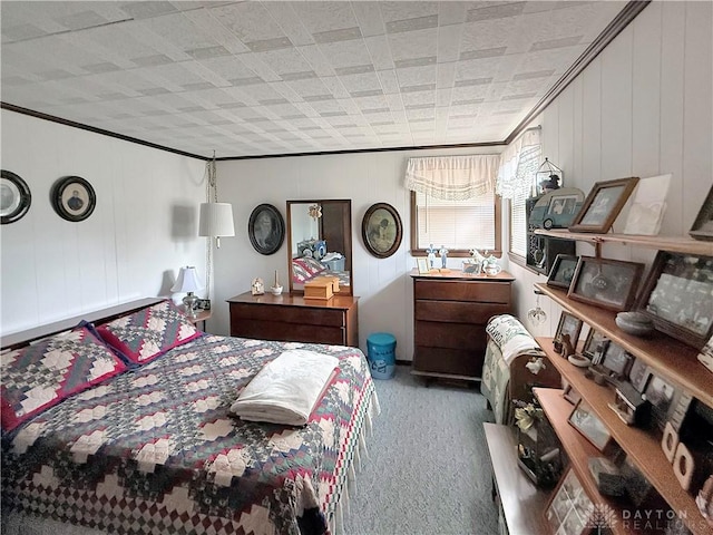 carpeted bedroom with ornamental molding