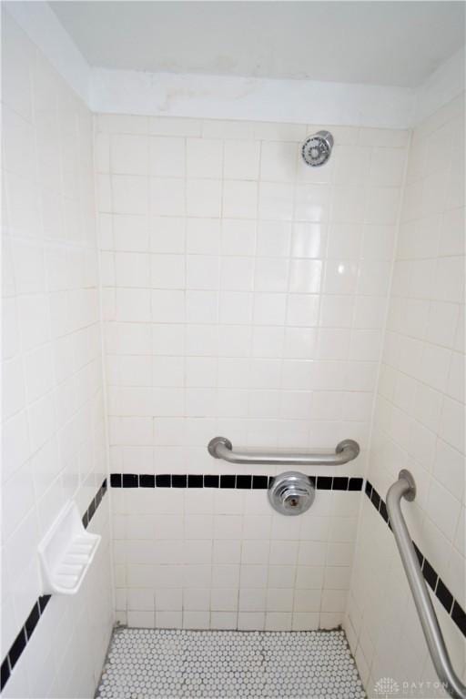 bathroom with tiled shower