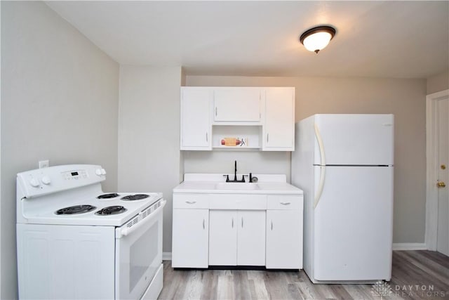kitchen featuring white appliances, white cabinetry, a sink, open shelves, and light wood-type flooring