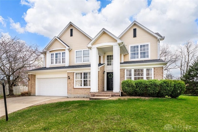 traditional home featuring driveway, brick siding, fence, a front lawn, and an attached garage