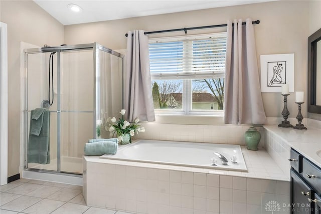 bathroom with a garden tub, tile patterned flooring, vanity, and a shower stall