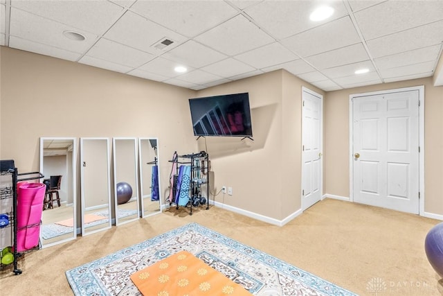 rec room with baseboards, a drop ceiling, carpet flooring, and recessed lighting