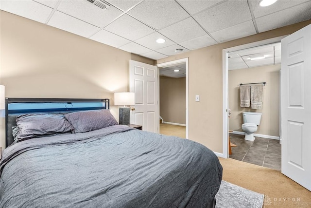 bedroom featuring visible vents, carpet floors, tile patterned flooring, a drop ceiling, and recessed lighting