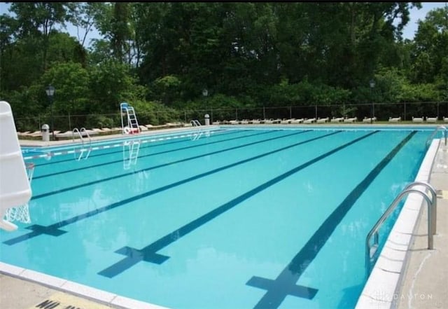 community pool featuring fence