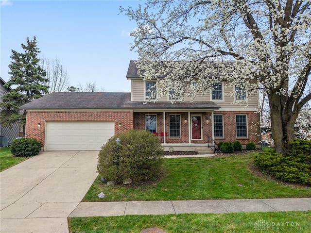 traditional home with a garage, a front yard, brick siding, a shingled roof, and concrete driveway