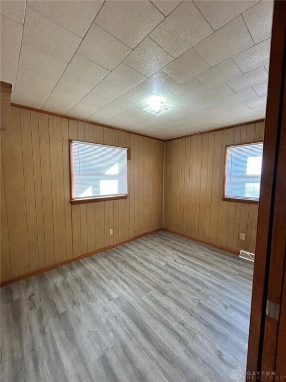 4322 Annapolis Ave, Dayton, OH 45416 - empty room featuring visible vents, baseboards, and wood finished floors