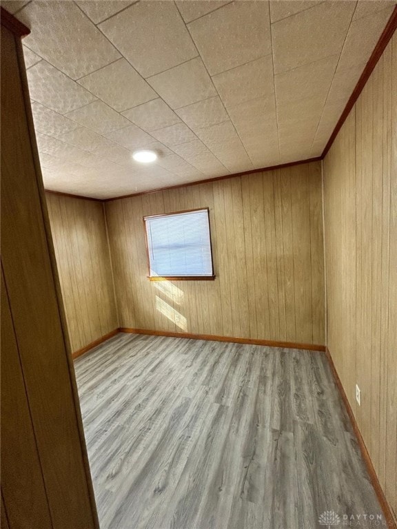 4322 Annapolis Ave, Dayton, OH 45416 - empty room with wooden walls, baseboards, and wood finished floors