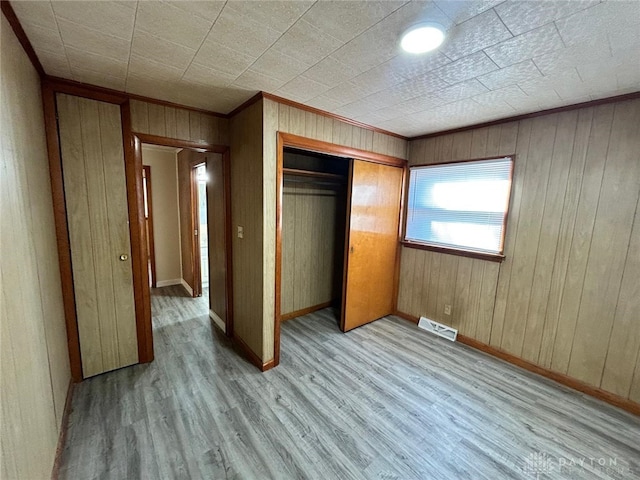 4322 Annapolis Ave, Dayton, OH 45416 - unfurnished bedroom featuring a closet, baseboards, and wood finished floors