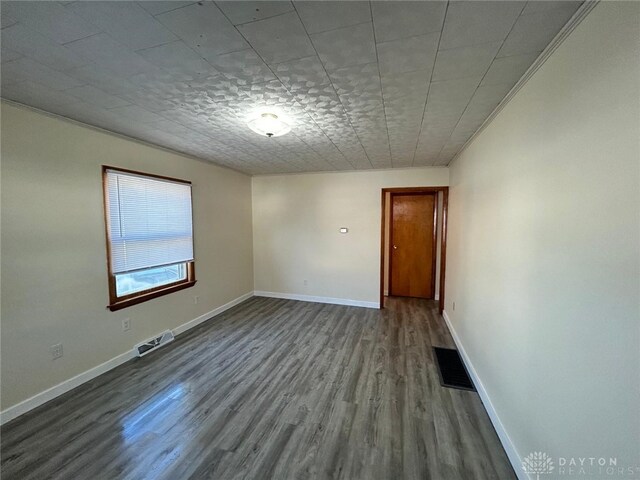 4322 Annapolis Ave, Dayton, OH 45416 - spare room with baseboards, visible vents, and wood finished floors