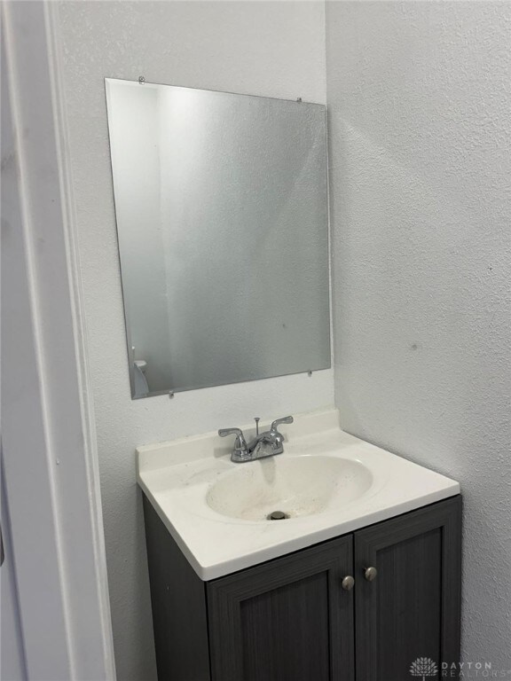 2312 Parkland Ave, Dayton, OH 45405 - bathroom with vanity and a textured wall